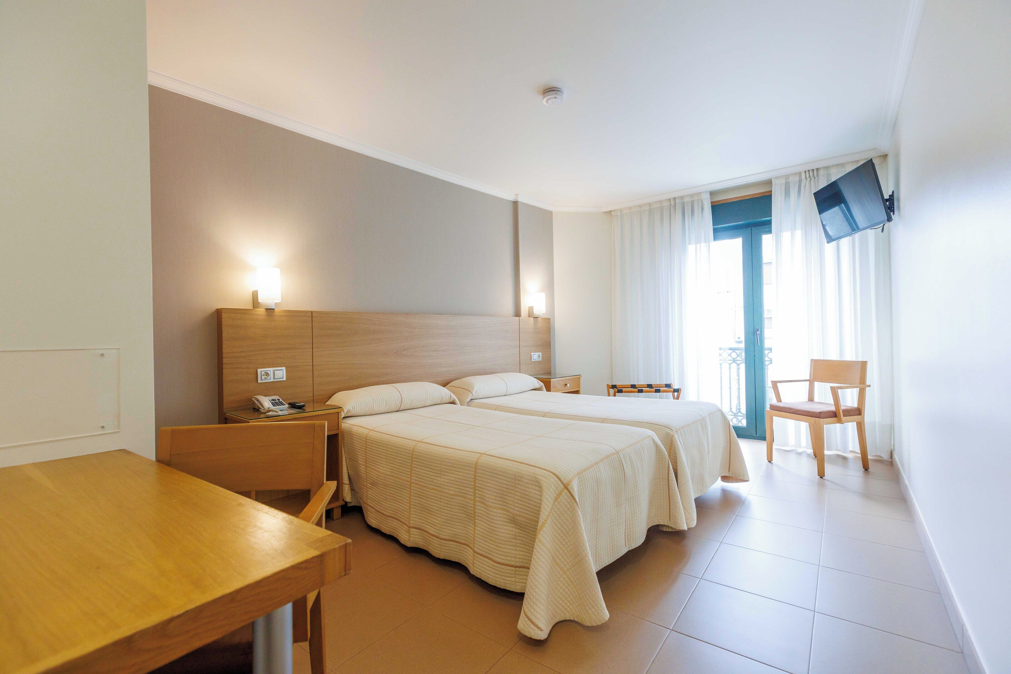 Premium bedding, down duvets, laptop workspace, blackout curtains