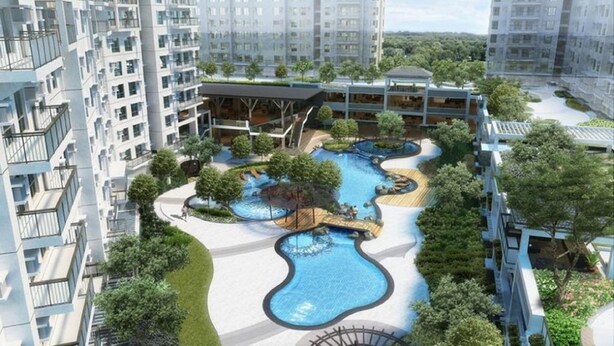 A modern residential complex with a central swimming pool, surrounded by greenery and connected to high-rise buildings. - Bella Lifestyle Studio (Tagaytay)