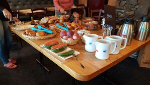 A breakfast buffet with various food items and beverages. - Hotel Panda (Pas de la Casa)