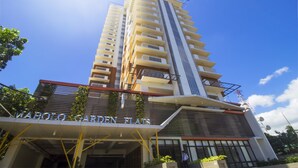 A high-rise building with a sign reading "MABOLO GARDEN FLATS". - Mabolo Garden Flat 1014 (Cebu City)