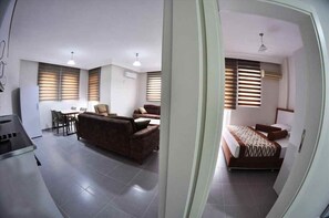 Family Room | 1 bedroom, premium bedding, minibar, in-room safe