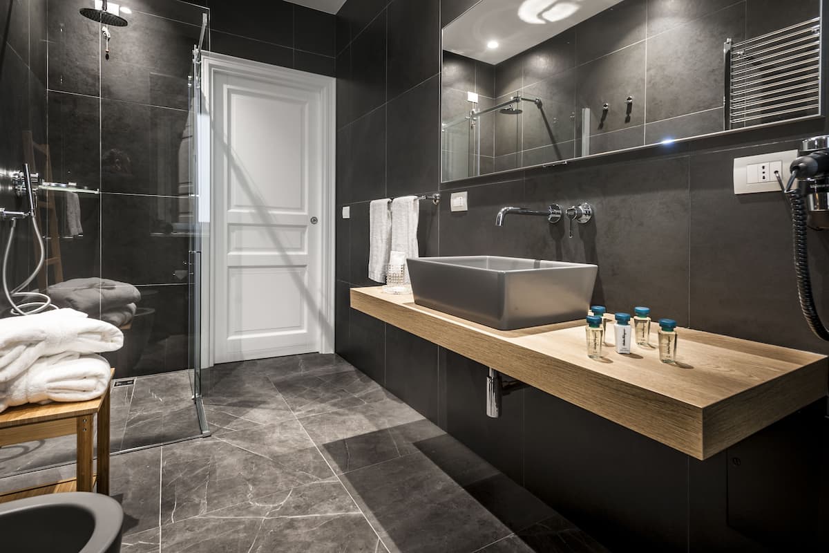 grand double room | bathroom | eco-friendly toiletries, hair dryer, bathrobes, slippers