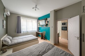 City Apart Daire, Bahçe Manzaralı | 2 yatak odası, odada kasa, ayrı ayrı dekore edilmiş, ayrı ayrı döşenmiş 