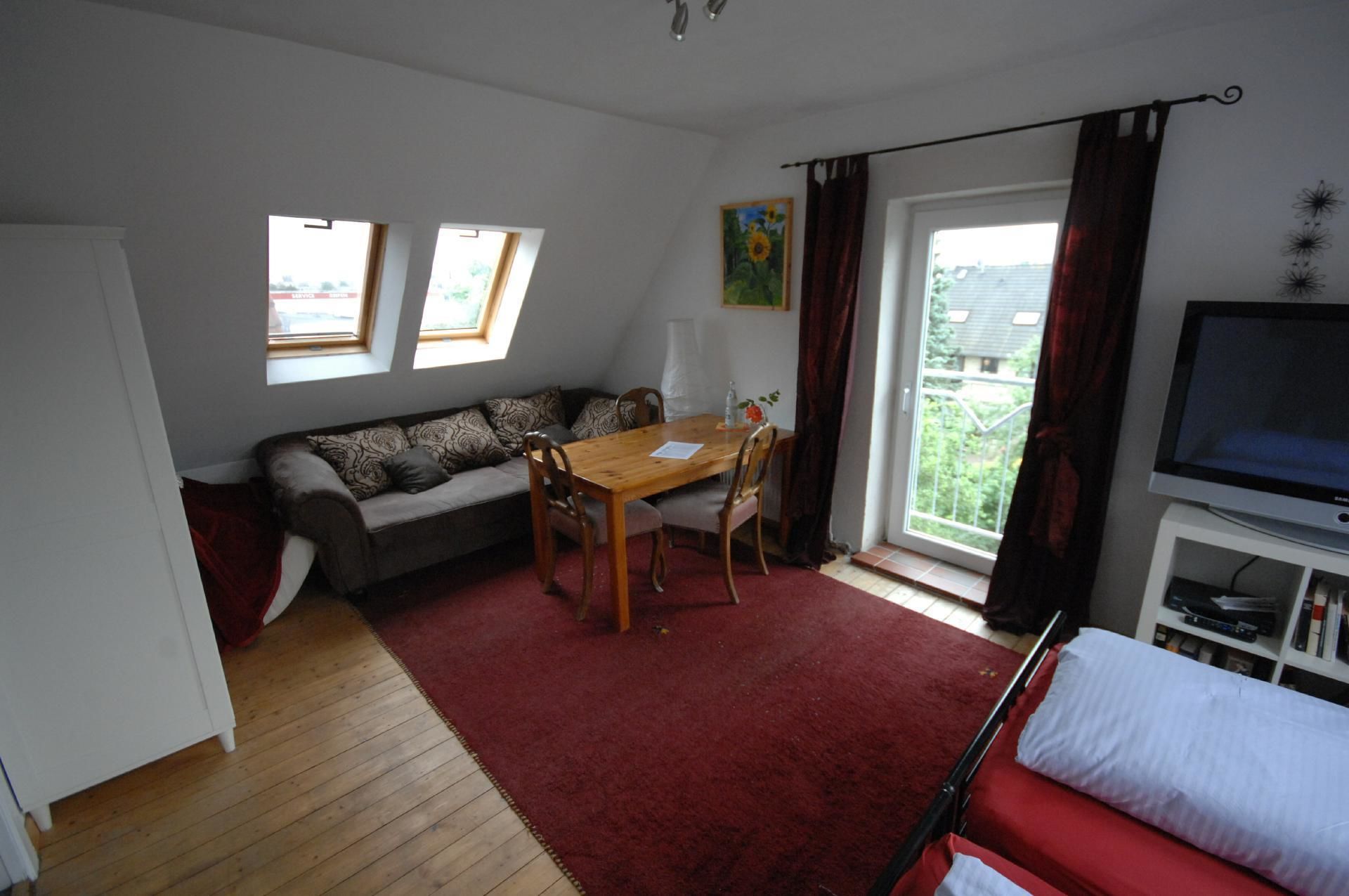 double room, shared bathroom | living area | flat-screen tv