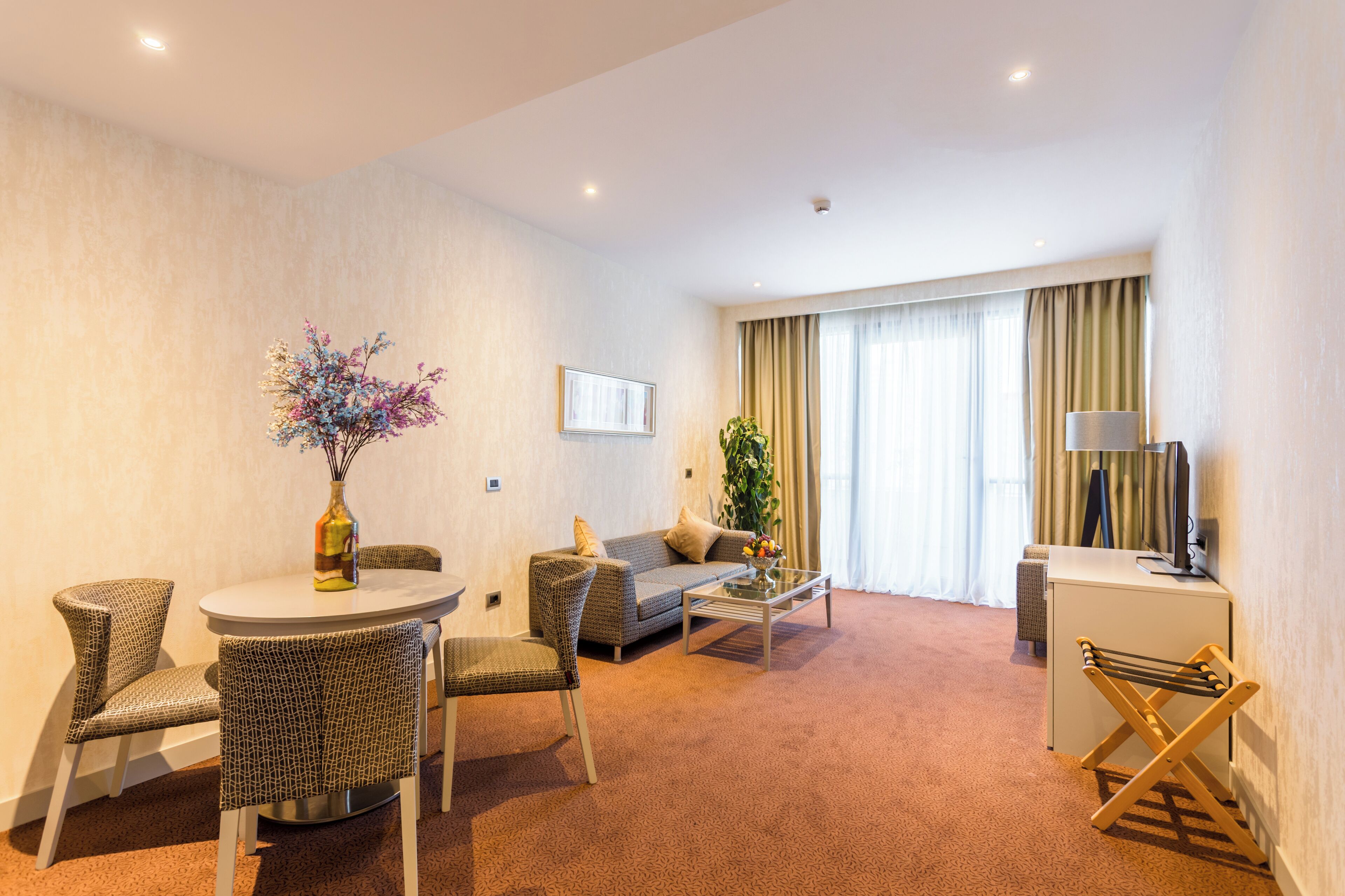 superior suite, city view | living area | 40-inch flat-screen tv with satellite channels, tv