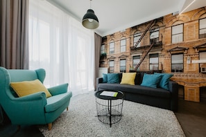 Exklusiv lägenhet - 2 sovrum - terrass - utsikt mot staden | Vardagsrum | Platt-tv