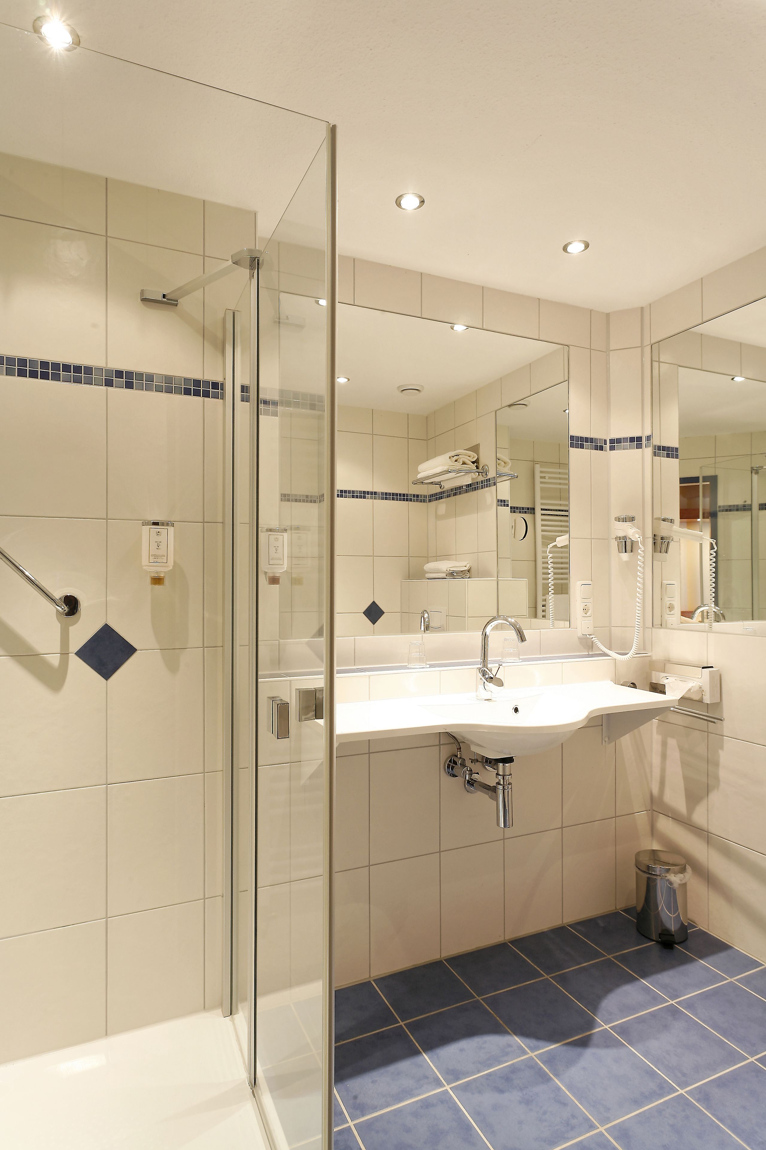 shower, free toiletries, hair dryer, towels