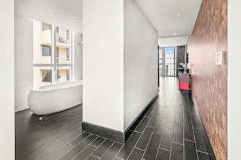 Suite, 1 King Bed, Bathtub | Hypo-allergenic bedding, minibar, in-room safe, desk at The Fairwind Hotel