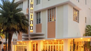 A multi-story hotel with a prominent 'FAIRWIND' sign, featuring a classic architectural style with large windows and a flat roof. - The Fairwind Hotel (Miami Beach)