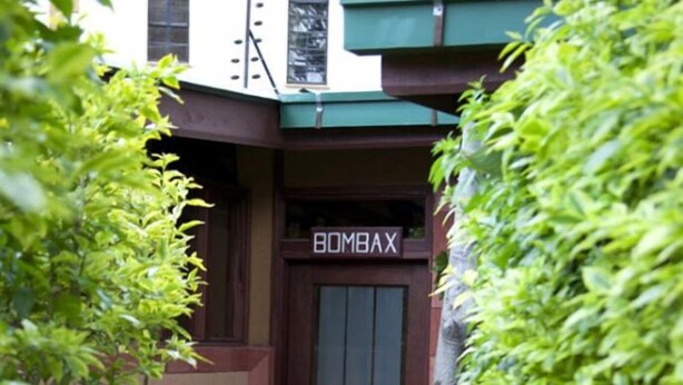 A building entrance with a sign reading "BOMBAX." - Gracia Gardens (Nairobi)