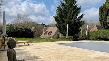 Seasonal outdoor pool, pool umbrellas, pool loungers