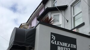 The exterior of the Glenheath Hotel, featuring a black awning, a sign with the hotel's name, and a window. - Glenheath Hotel (Blackpool)