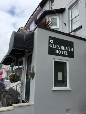 A building with a sign reading '73 GLENHEATH HOTEL' and a small window. - Glenheath Hotel (Blackpool)