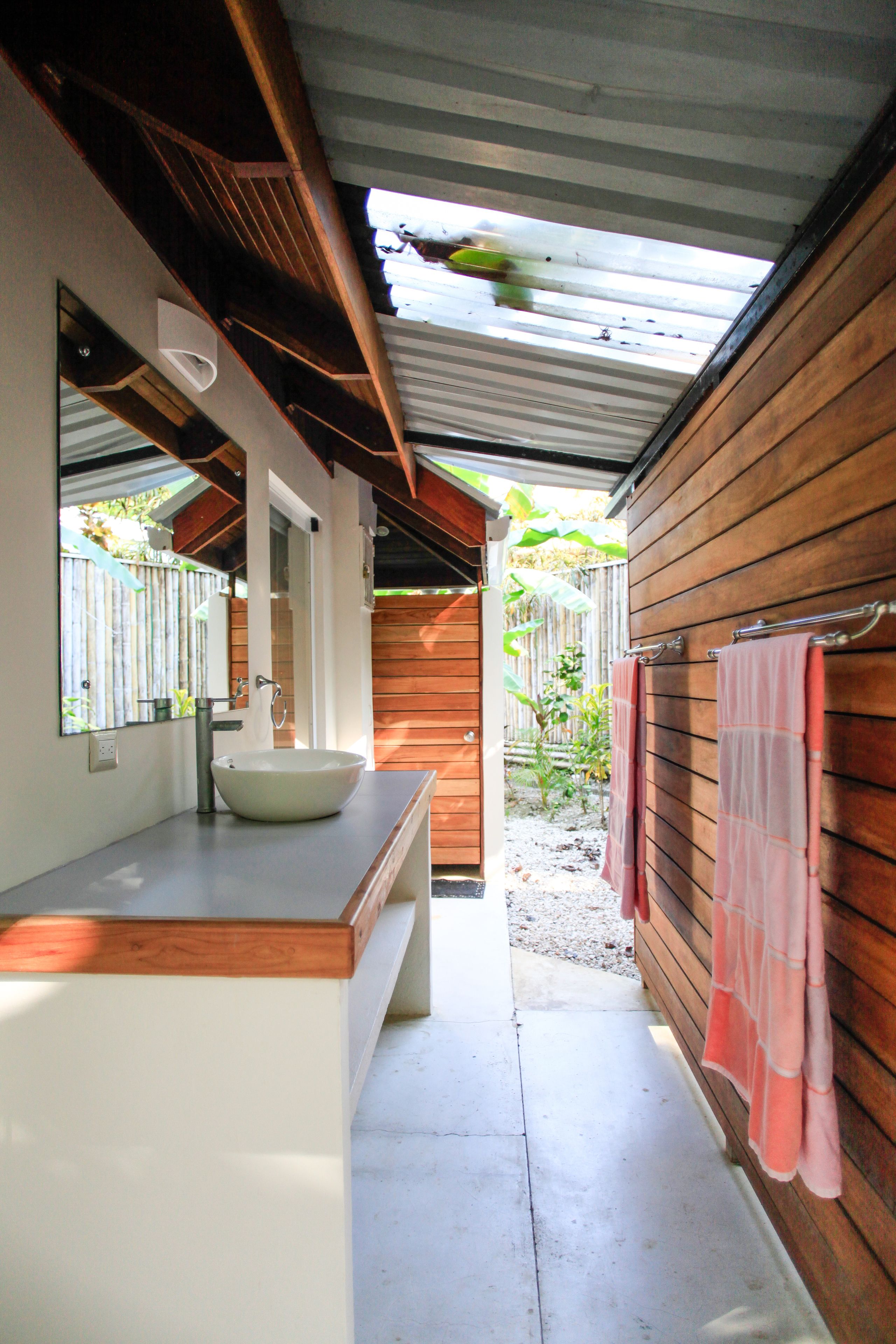 deluxe quadruple room, multiple beds, beachside (casa cassandra) | bathroom | shower, free toiletries, hair dryer, towels