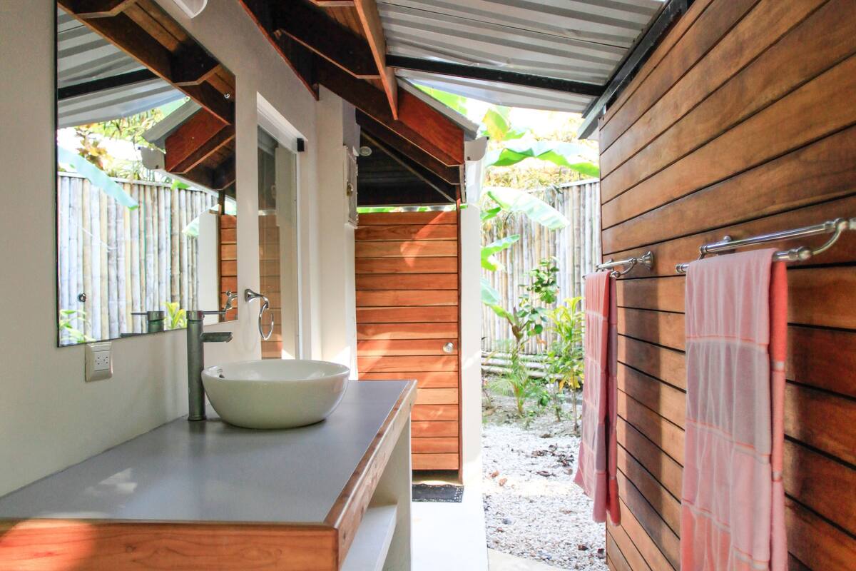 deluxe quadruple room, multiple beds, beachside (casa cassandra) | bathroom | shower, free toiletries, hair dryer, towels