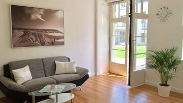 Apartamento (Twenty) | Zona de estar | Una televisión de pantalla plana