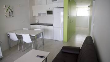 Full-size fridge, microwave, stovetop, coffee/tea maker