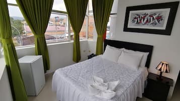 Down comforters, pillowtop beds, minibar, desk