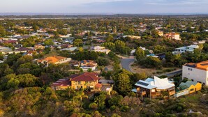 A residential area with houses, roads, and greenery. - Oceana Sunset - Beachfront family friendly home with amazing ocean views (Warnbro)