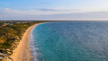 On the beach, sun-loungers, beach towels