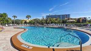 A swimming pool with a 3ft 9in depth marker, surrounded by lounge chairs and palm trees. - AJ's Bayside Treasure - Outstanding Waterfront Views & Private Beach Access! (Sarasota)