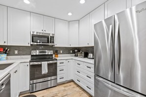 Fridge, microwave, stovetop, coffee/tea maker