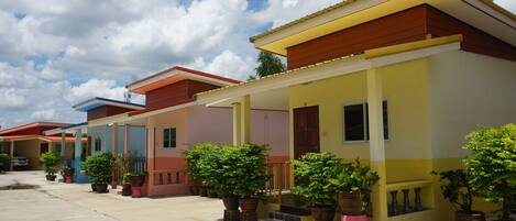 A row of colorful houses with a clear sky.