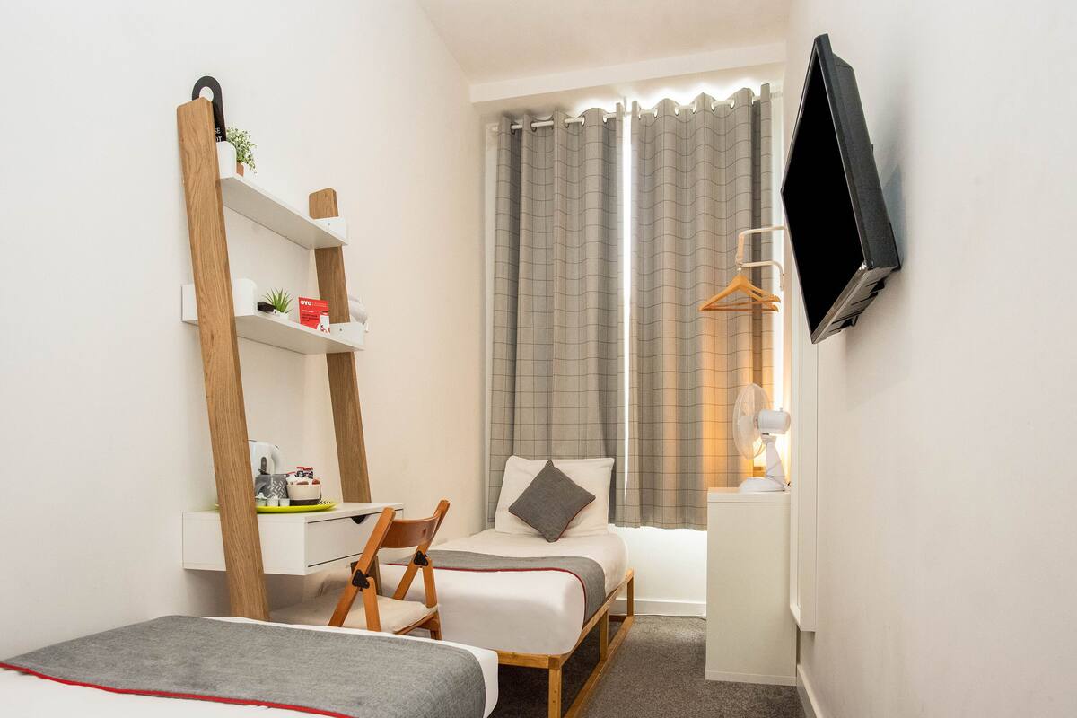 Standaard Twin kamer, 2 eenpersoonsbedden | Verduisterende gordijnen, gratis wifi, beddengoed