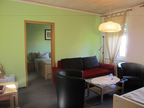 Family Room, 2 Bedrooms, Garden View | Living area | Flat-screen TV - Pension Mahrets Puppenstube (Eisenach)