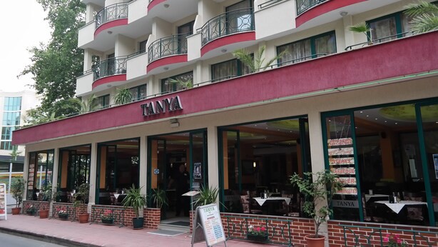 A multi-story building with a red awning and the name 'TANYA' on the facade. - Tanya Hotel (Sunny Beach)