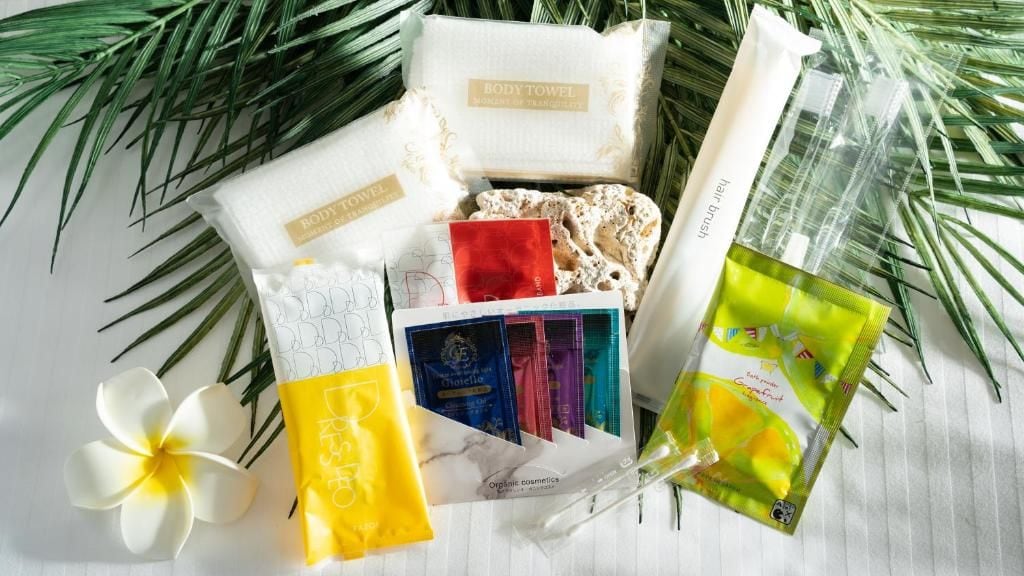 A variety of personal care items including body towels, organic cosmetics, and a face mask.