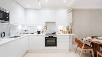 Two Bedroom Executive apartment | Private kitchen | Full-sized fridge, microwave, oven, stovetop