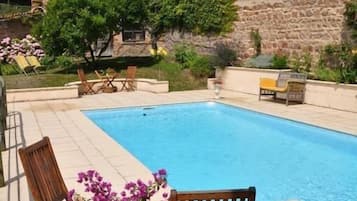 Outdoor pool, a heated pool, sun loungers