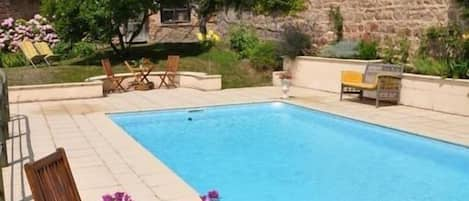 Outdoor pool, a heated pool, sun loungers