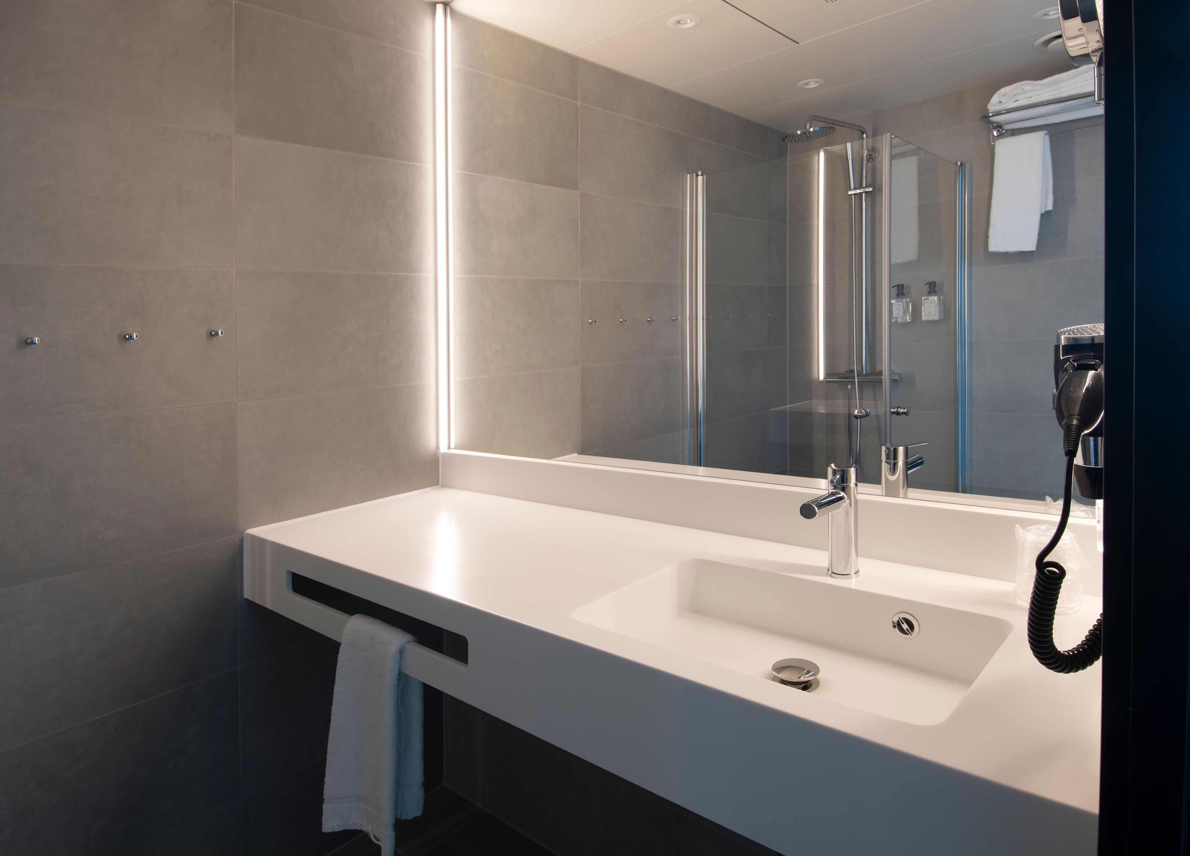 shower, rainfall showerhead, hair dryer, towels