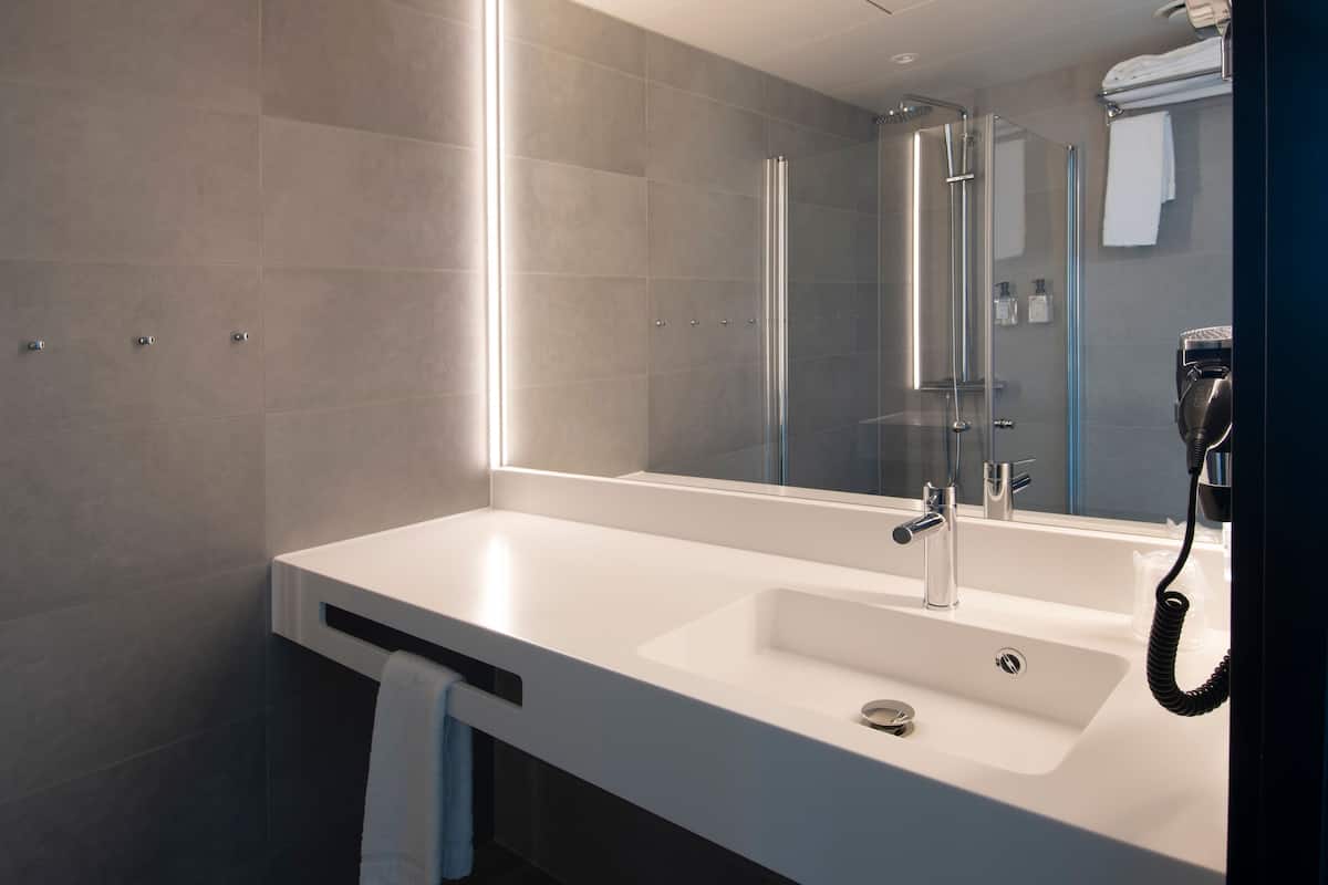 shower, rainfall showerhead, hair dryer, towels