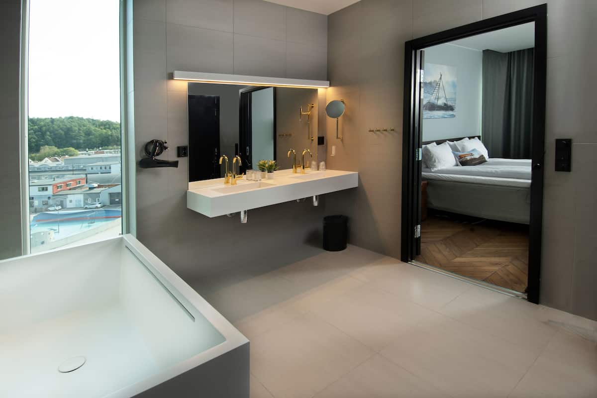 suite | bathroom | shower, rainfall showerhead, hair dryer, towels