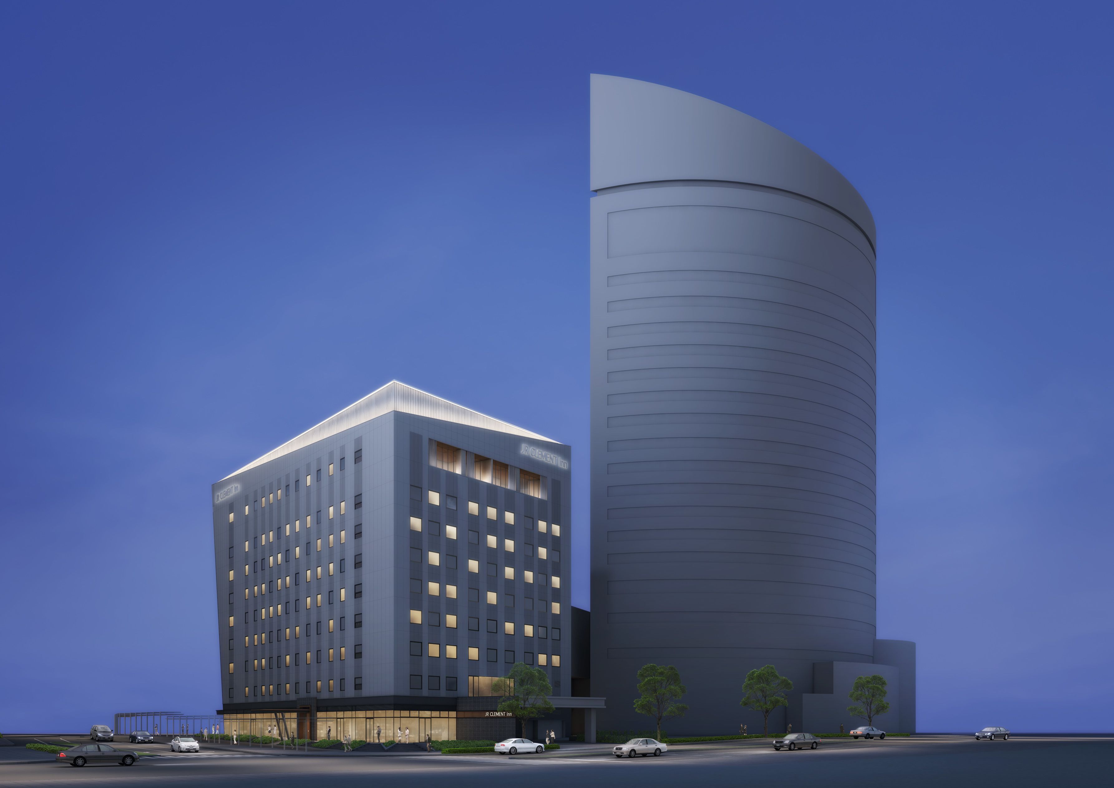 A modern hotel with a rectangular building and a cylindrical tower.