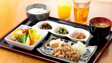 A tray with various dishes including rice, a salad, and a bowl of soup.