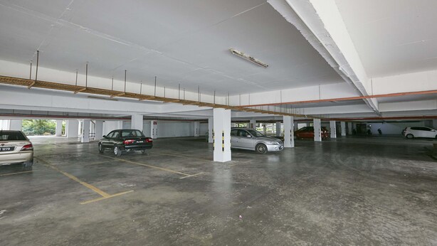 A multi-level parking garage with several cars parked. - JC Sunshine Bay Resort Port Dickson (Port Dickson)