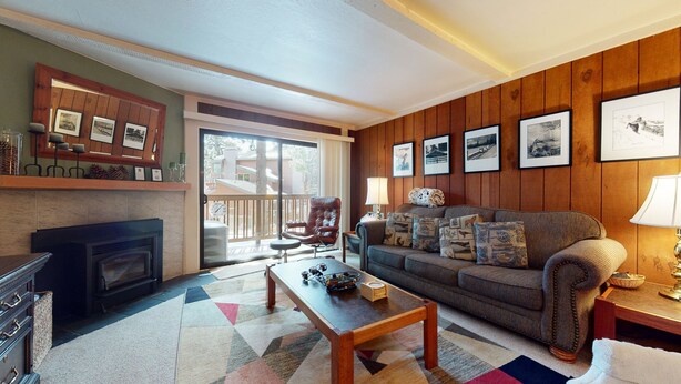 A cozy living room with a fireplace, a sofa set, and a coffee table. - Summit #45 1 Bedroom Condo (Mammoth Lakes)