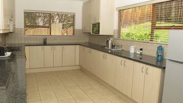 Apartment | Private kitchen | Full-size fridge, microwave, oven, stovetop