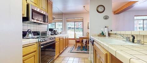 Condo, 2 Bedrooms | Private kitchen | Fridge, microwave, oven, dishwasher