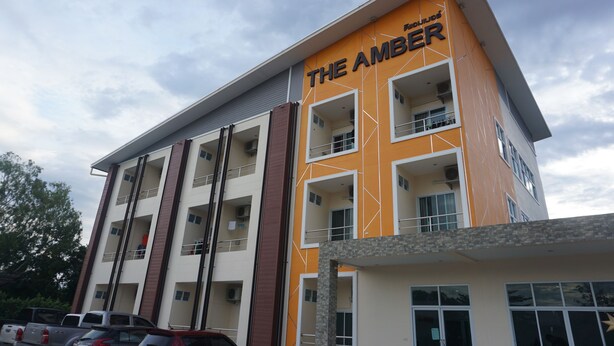 A multi-story hotel with balconies and a prominent sign reading "THE AMBER". - The Amber Mansion (Roi Et)