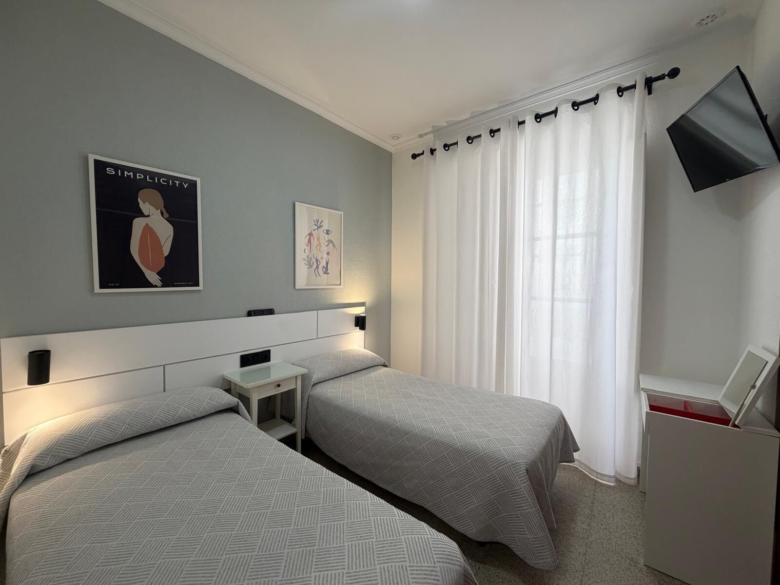 Desk, blackout curtains, free WiFi, bed sheets