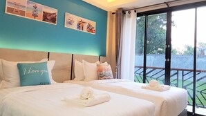 A hotel room with two beds, a large window, and a balcony. - SeeSea Resort (La-ngu)