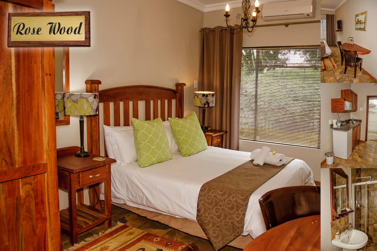 A neatly arranged bedroom with a bed, bedside tables, a lamp, and a sign reading "Rose Wood".