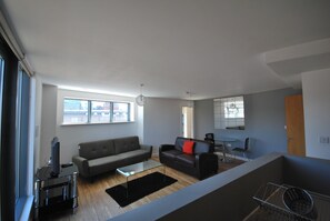 Apartment, 2 Bedrooms, Balcony | Living room | Flat-screen TV - Atana Apartments (Manchester)