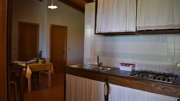 Comfort Apartment, 1 Bedroom, Patio (Margherita) | Private kitchen | Fridge, oven, stovetop, cookware/dishes/utensils