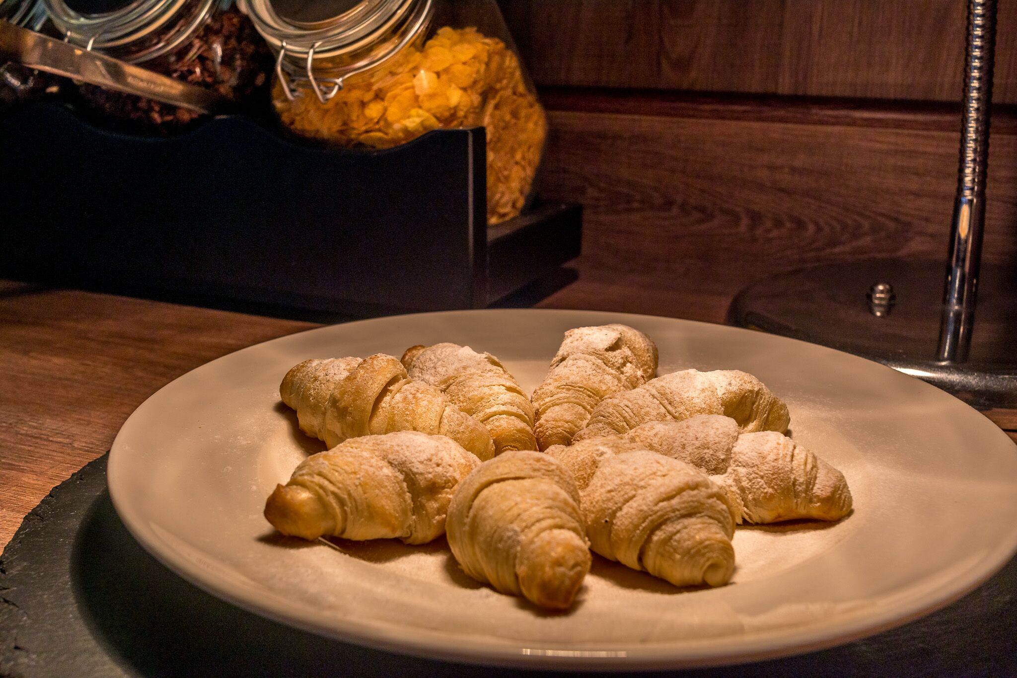 A plate of croissants on a white plate.